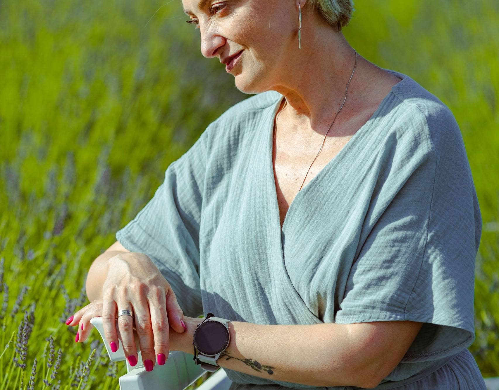 A serene moment captured of a woman enjoying nature in a Ukrainian lavender field.